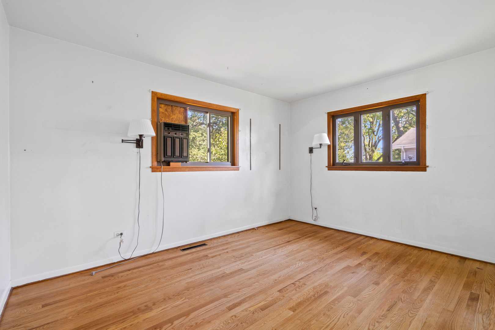 244 Thomas Street Park Forest, IL 60466 - Photo 12 of 30 a view of an empty room with wooden floor and a window