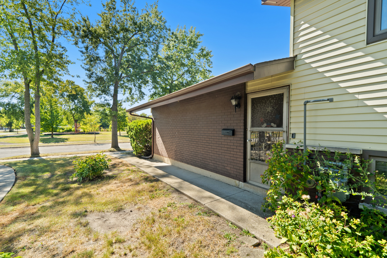 244 Thomas Street Park Forest, IL 60466 - Photo 2 of 30 a backyard of a house with large trees