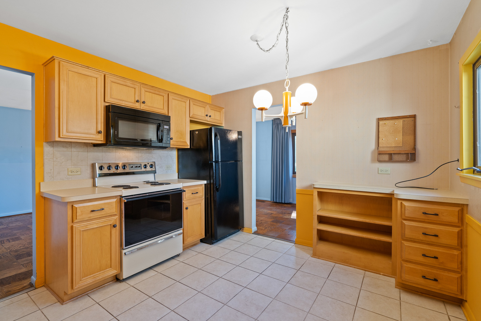 244 Thomas Street Park Forest, IL 60466 - Photo 9 of 30 a kitchen with stainless steel appliances granite countertop a stove top oven a refrigerator and a sink