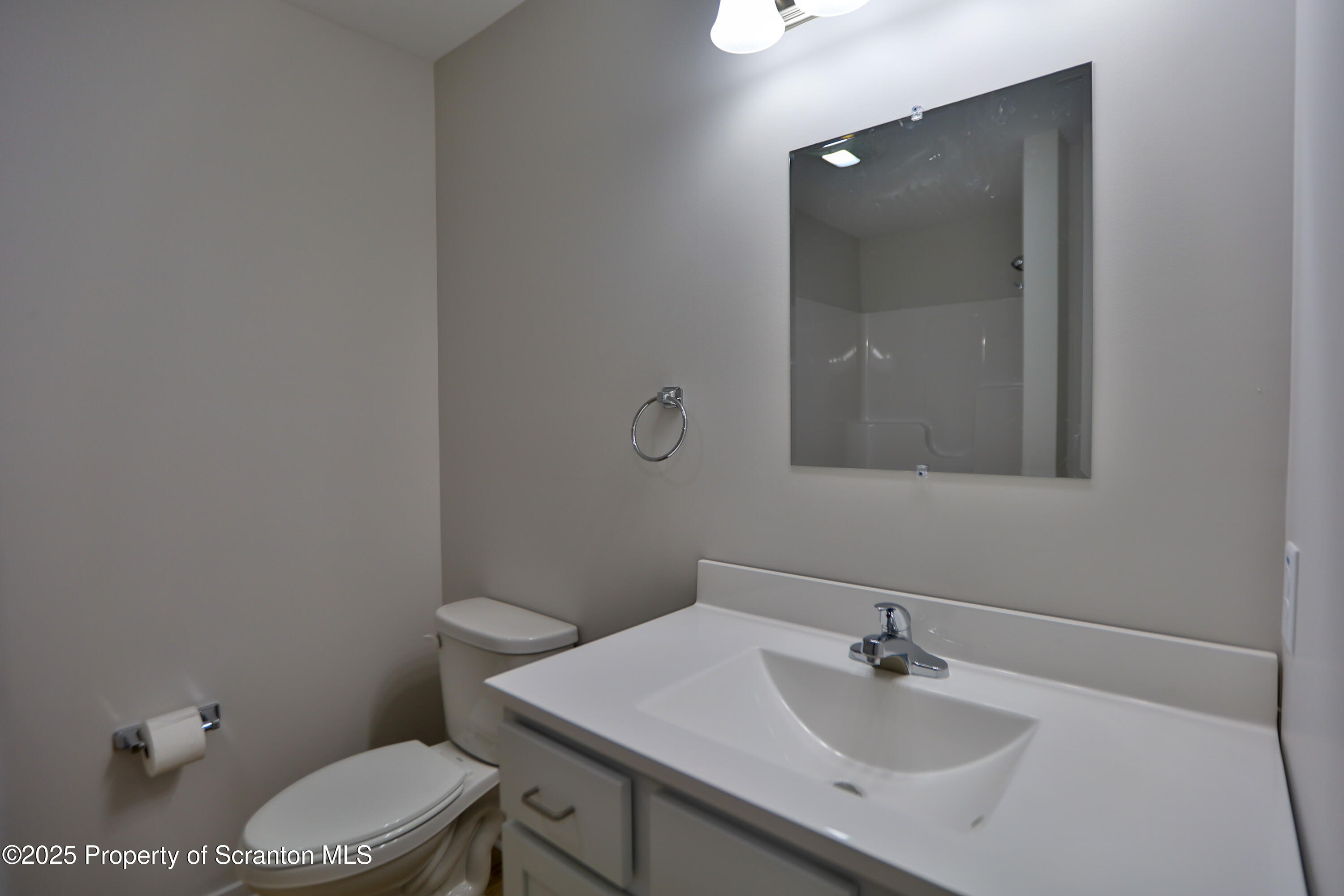 160 Bianca Way Old Forge, PA 18518 - Photo 13 of 19 a bathroom with a sink toilet and mirror