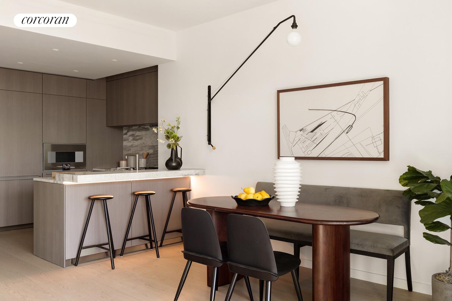 500 West 18th Street, Unit WEST5B Manhattan, NY 10011 - Photo 4 of 15 a kitchen with a table chairs and a refrigerator