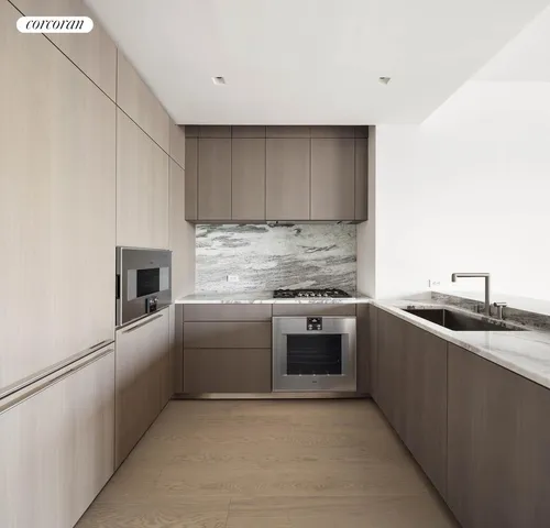 a kitchen with a table chairs and a refrigerator