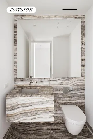 a bathroom with a granite countertop bathtub shower sink and mirror