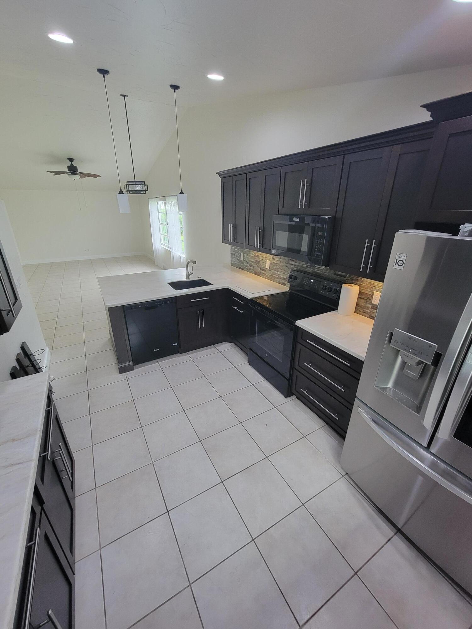 104 Arrowhead Circle Jupiter, FL 33458 - Photo 11 of 21 20251002_164915