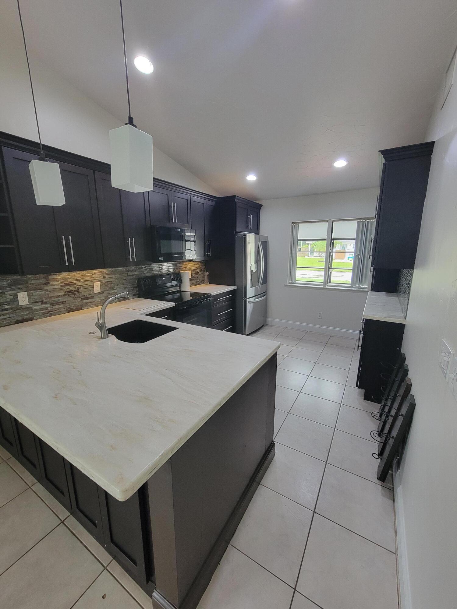 104 Arrowhead Circle Jupiter, FL 33458 - Photo 9 of 21 20251002_164851