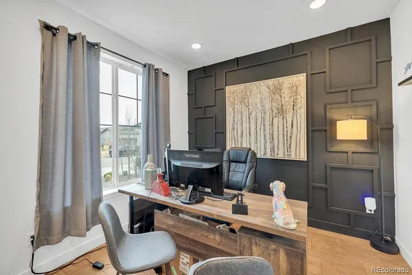 a work room with furniture and a window