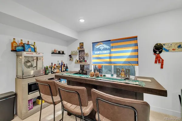 a kitchen with a sink a stove and a refrigerator