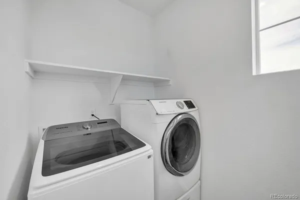 a utility room with dryer and washer