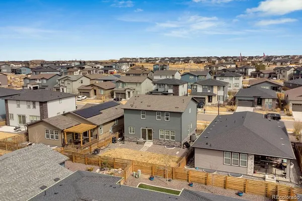 an aerial view of a house with a yard garage and outdoor seating