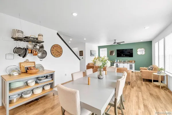 a living room with furniture and flat screen tv