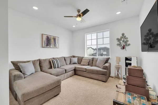 a living room with furniture and a window