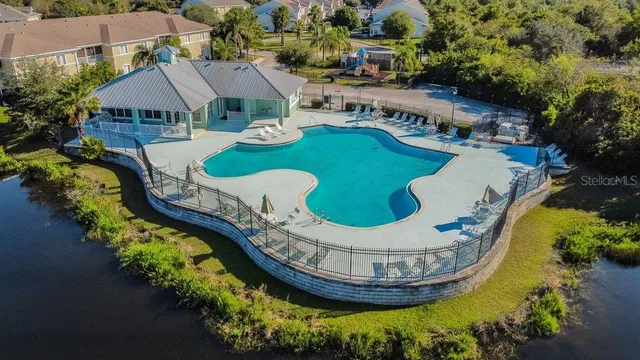 an aerial view of residential building and lake