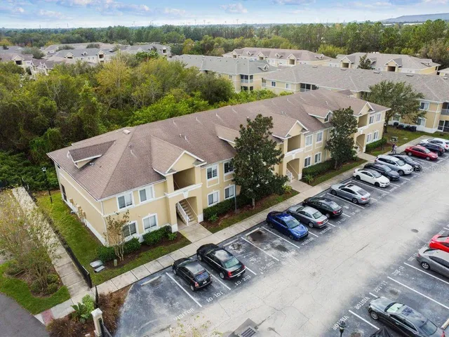 a view of a backyard with sitting area