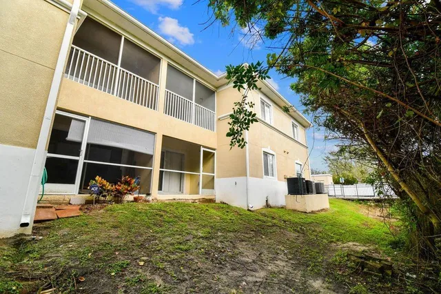 an aerial view of a house with outdoor space