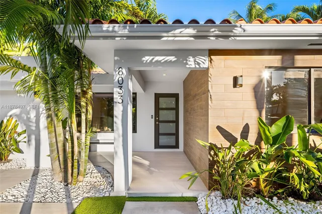 a kitchen with a sink and a large window