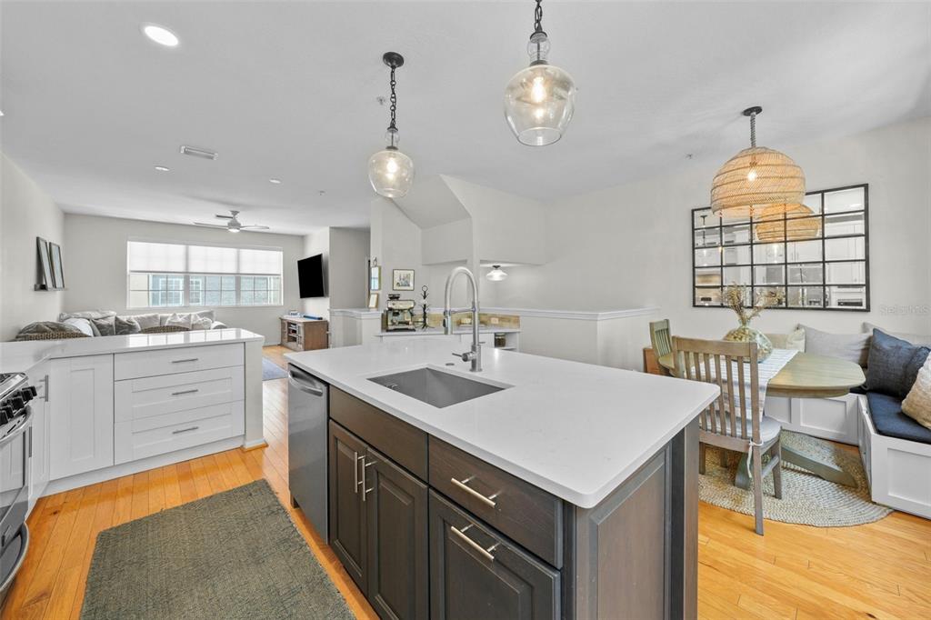 1451 Harbour Walk Road Tampa, FL 33602 - Photo 11 of 51 a kitchen with a sink stove and wooden floor