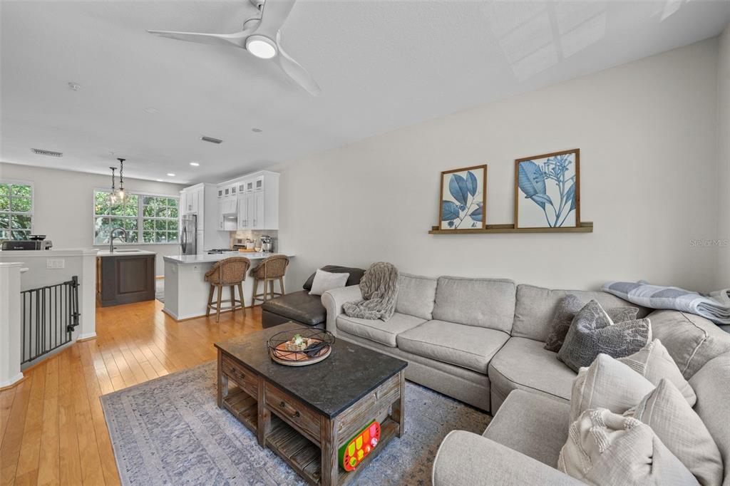 1451 Harbour Walk Road Tampa, FL 33602 - Photo 14 of 51 a living room with furniture couches and a dining table with wooden floor