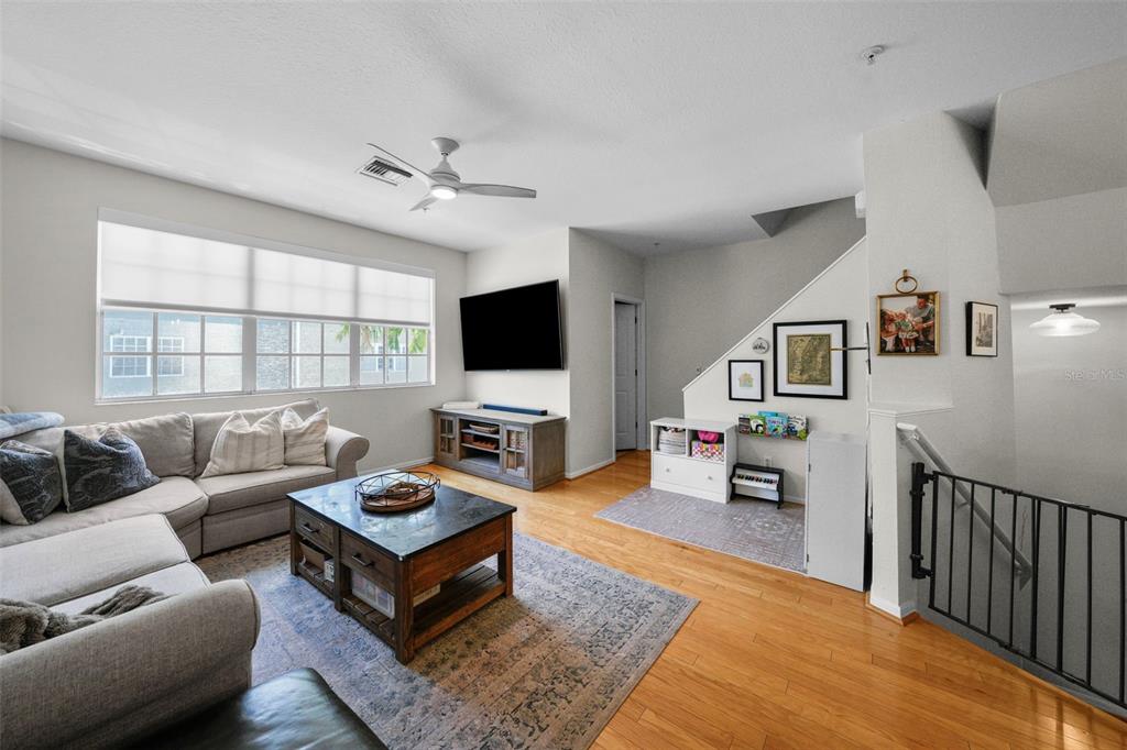 1451 Harbour Walk Road Tampa, FL 33602 - Photo 16 of 51 a living room with furniture and a flat screen tv