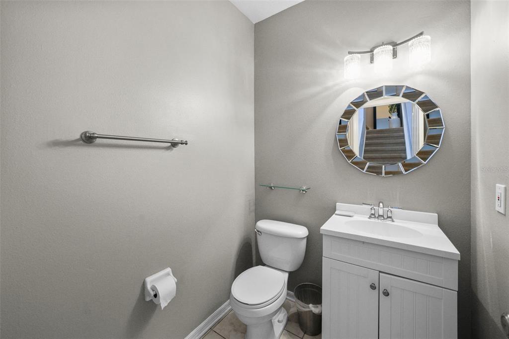 1451 Harbour Walk Road Tampa, FL 33602 - Photo 17 of 51 a bathroom with a toilet a sink and mirror
