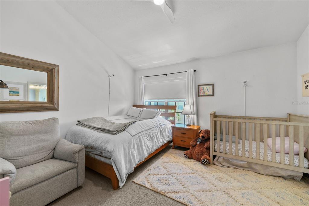 1451 Harbour Walk Road Tampa, FL 33602 - Photo 24 of 51 a bedroom with a bed and a couch