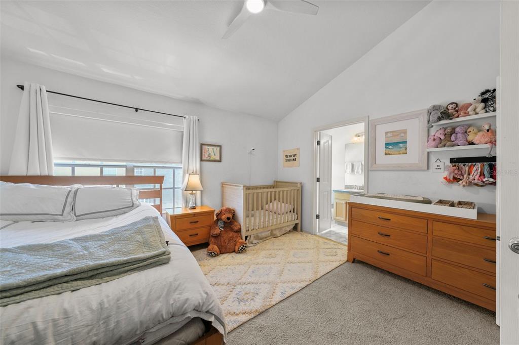 1451 Harbour Walk Road Tampa, FL 33602 - Photo 26 of 51 a bedroom with a large bed and a dresser