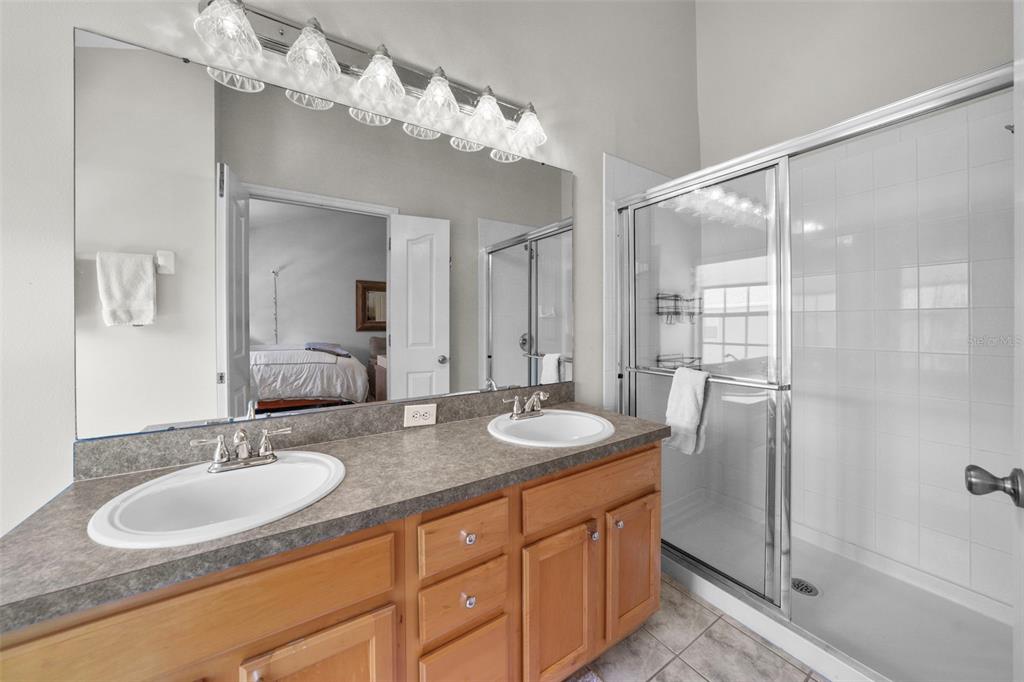 1451 Harbour Walk Road Tampa, FL 33602 - Photo 27 of 51 a bathroom with double vanity sinks and a mirror