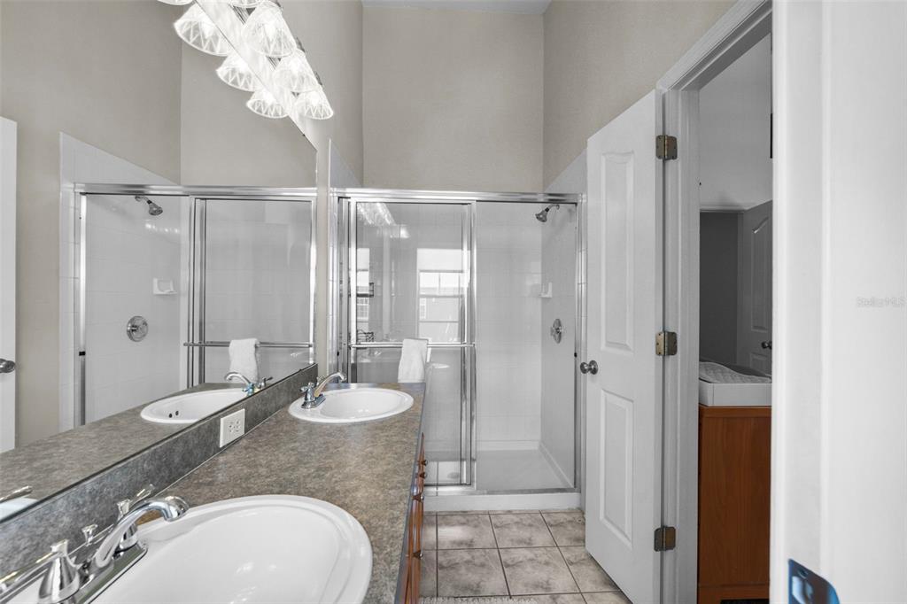 1451 Harbour Walk Road Tampa, FL 33602 - Photo 28 of 51 a bathroom with a granite countertop sink toilet and shower