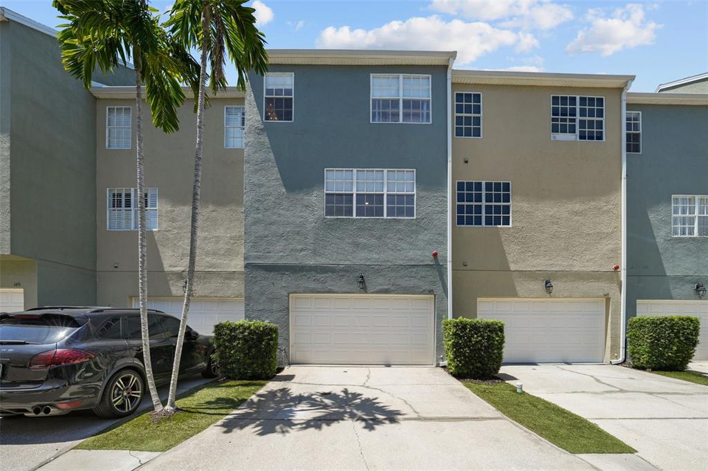 1451 Harbour Walk Road Tampa, FL 33602 - Photo 35 of 51 a front view of a house with a garden and parking space