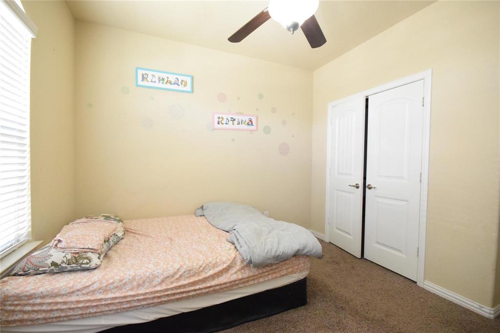 12421 Hitch Rack Way McKinney, TX 75071 - Photo 9 of 21 a bedroom with a bed and a window