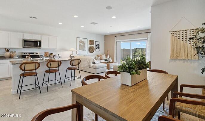549 West Freedom Street Florence, AZ 85132 - Photo 14 of 26 a view of a dining room with furniture