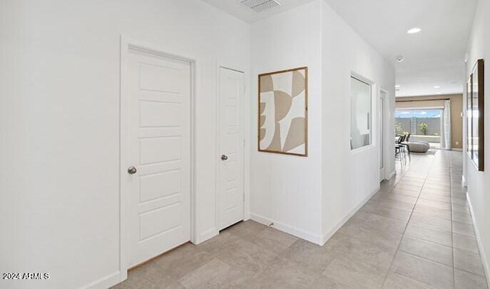 549 West Freedom Street Florence, AZ 85132 - Photo 4 of 26 a view of a hallway with wooden floor and a living room