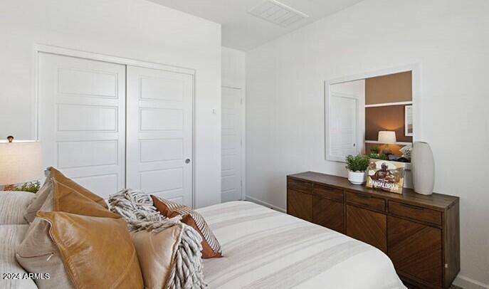 549 West Freedom Street Florence, AZ 85132 - Photo 6 of 26 a bedroom with a bed and a dresser