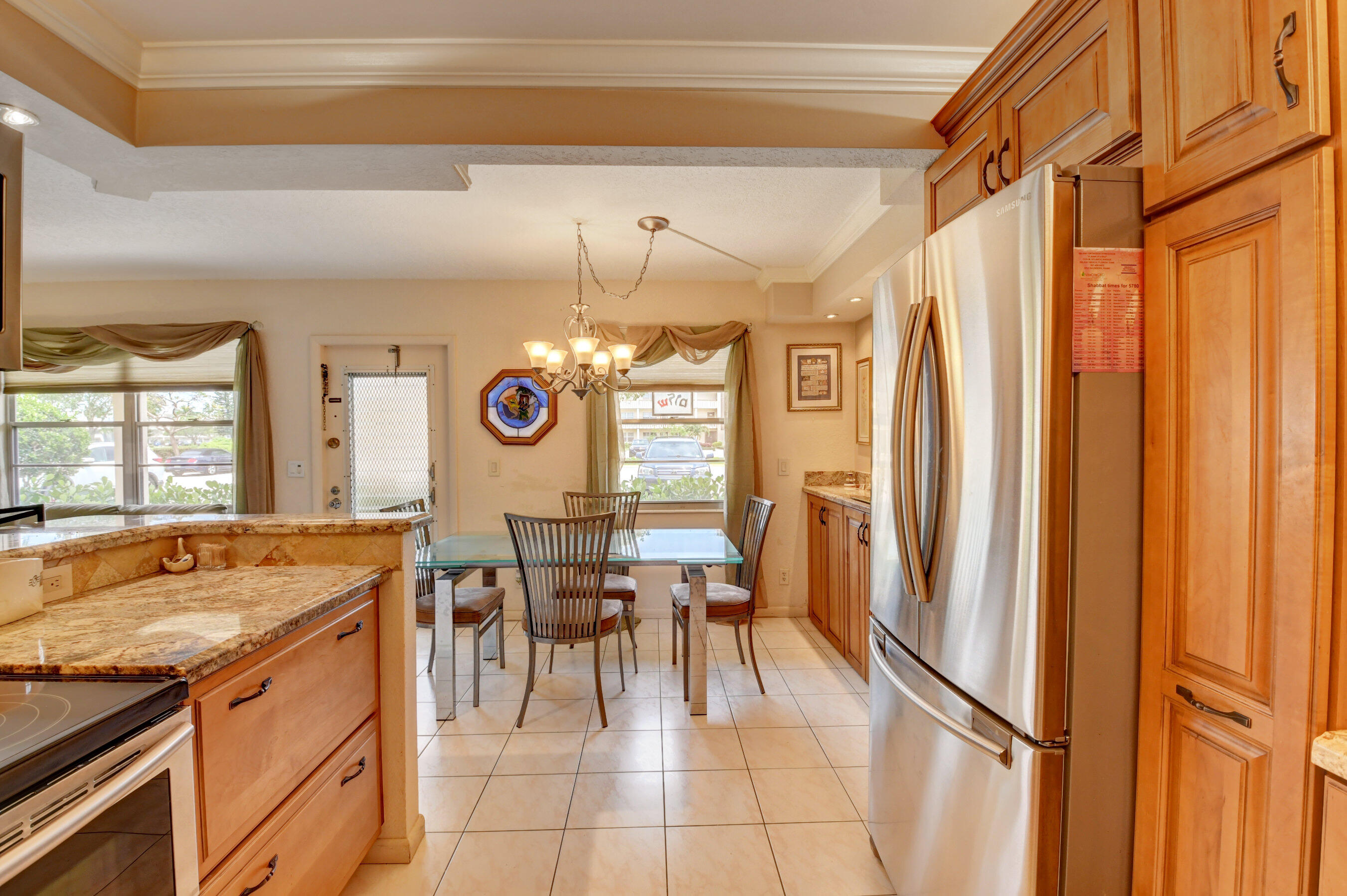 1045 Wolverton C, Unit 1045 Boca Raton, FL 33434 - Photo 13 of 67 a view of a kitchen with furniture and windows