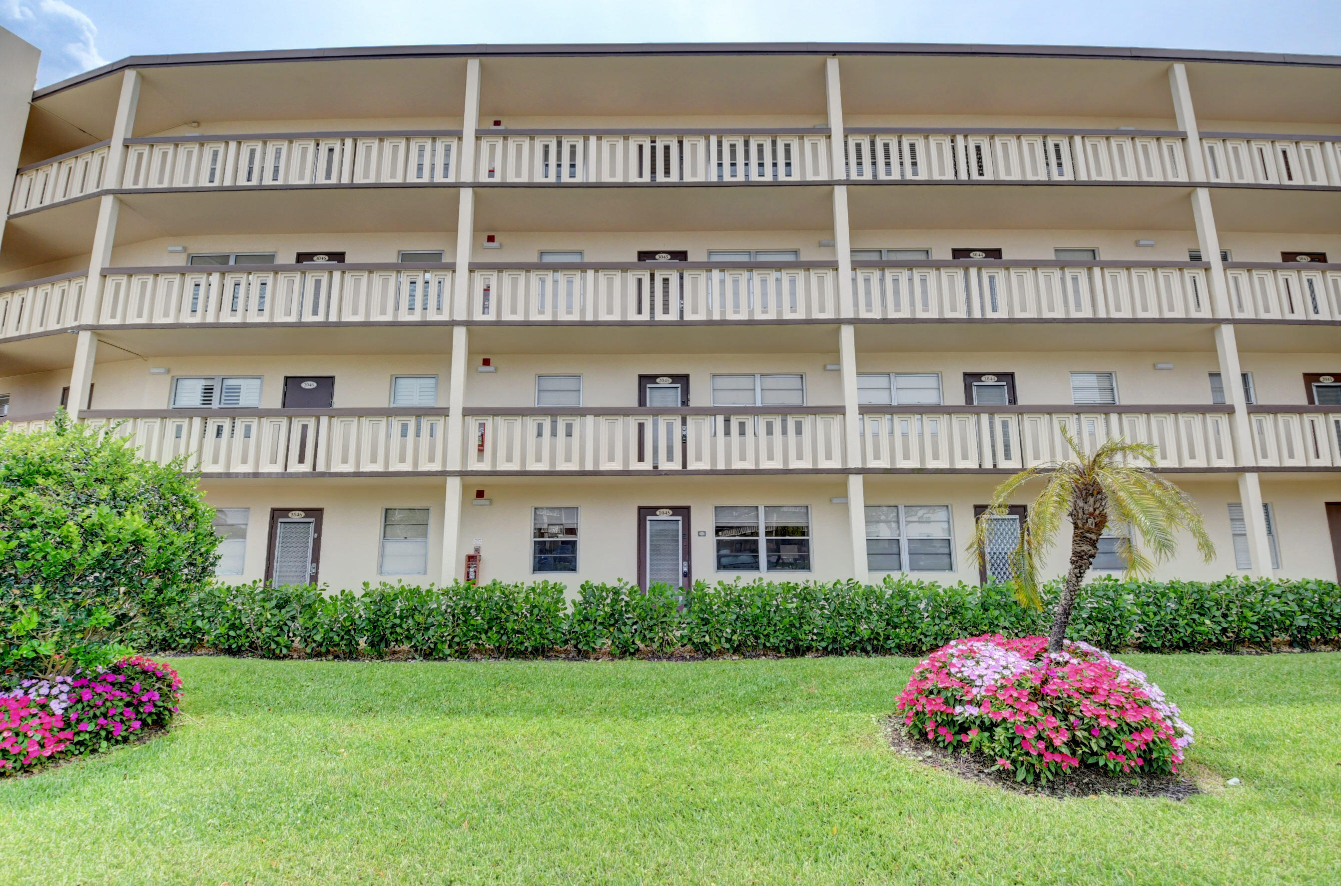 1045 Wolverton C, Unit 1045 Boca Raton, FL 33434 - Photo 3 of 67 a front view of a building