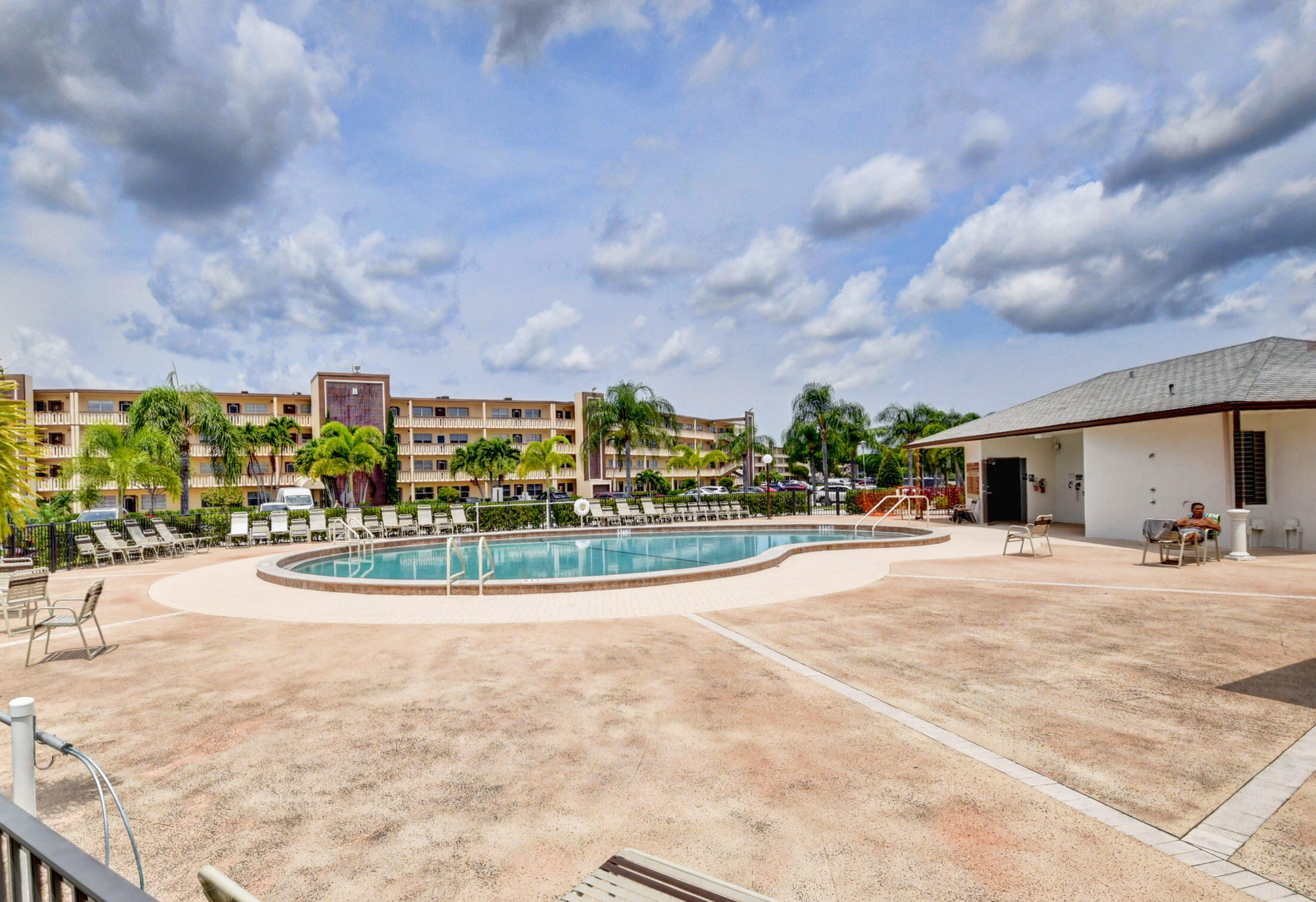 1045 Wolverton C, Unit 1045 Boca Raton, FL 33434 - Photo 35 of 67 a view of a basket ball ground in front of the house
