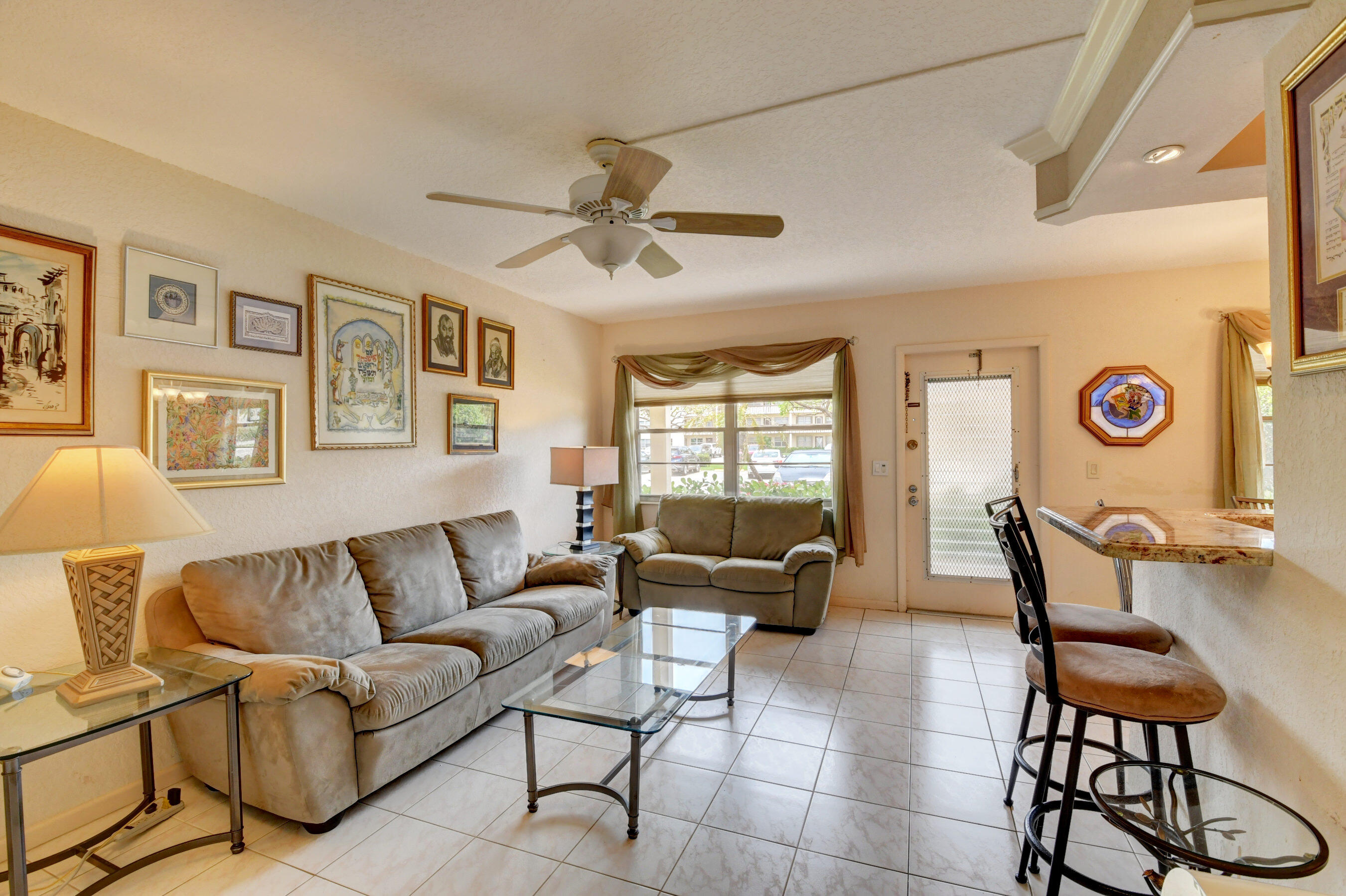 1045 Wolverton C, Unit 1045 Boca Raton, FL 33434 - Photo 7 of 67 a living room with furniture and a window