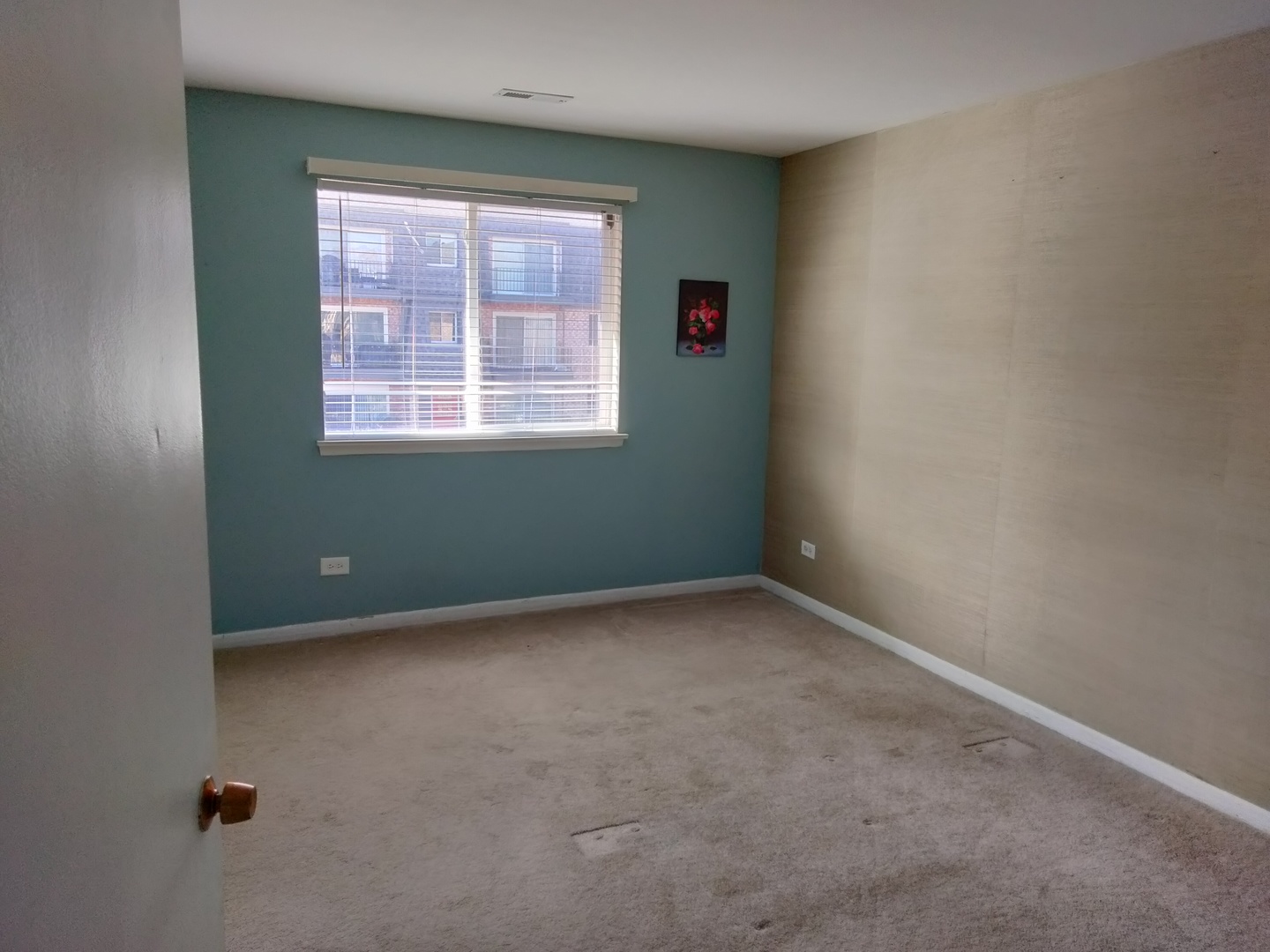 896 South Plum Grove Road, Unit 217 Palatine, IL 60067 - Photo 12 of 15 an empty room with a window