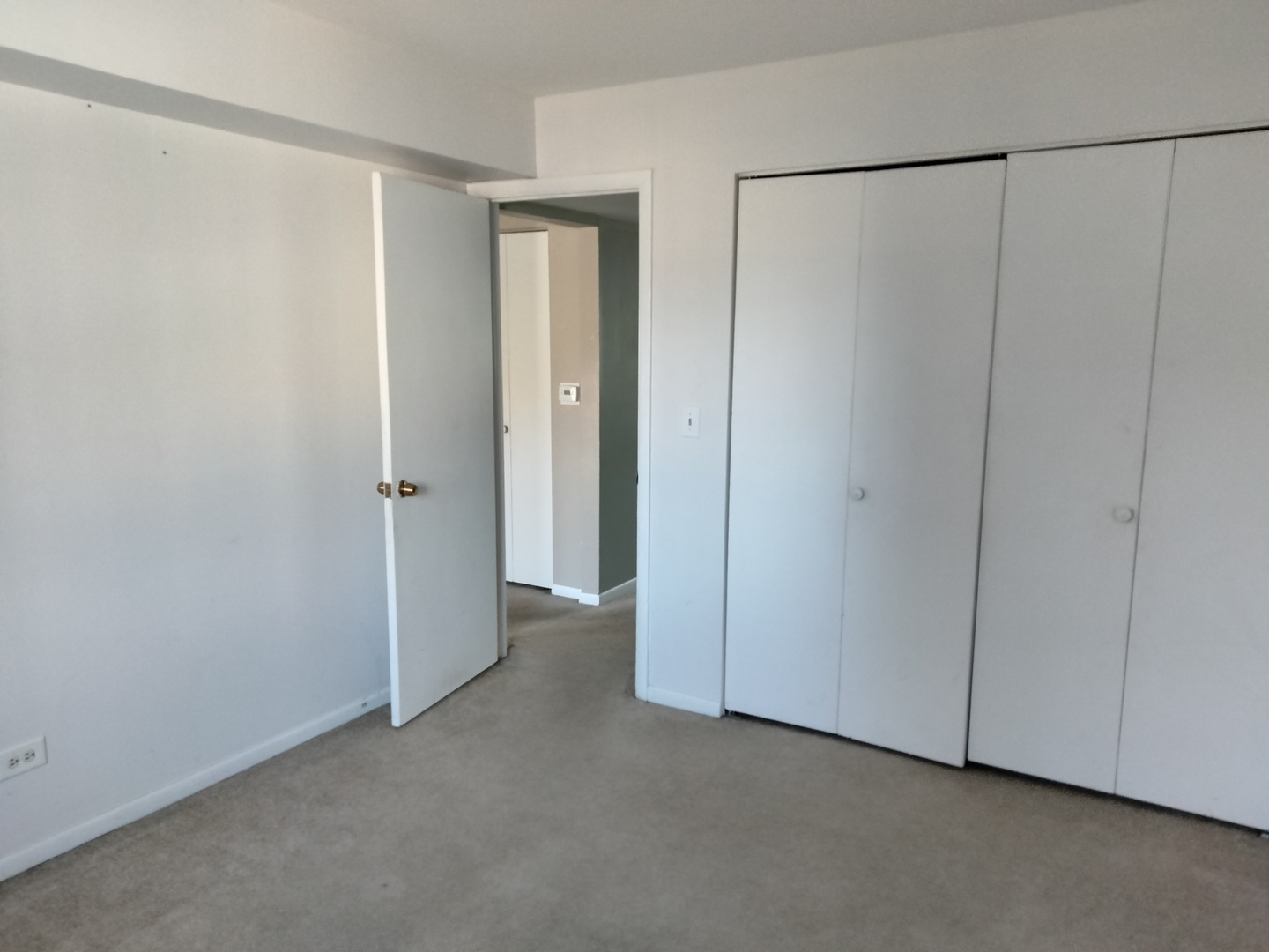 896 South Plum Grove Road, Unit 217 Palatine, IL 60067 - Photo 14 of 15 a view of a room with an empty space