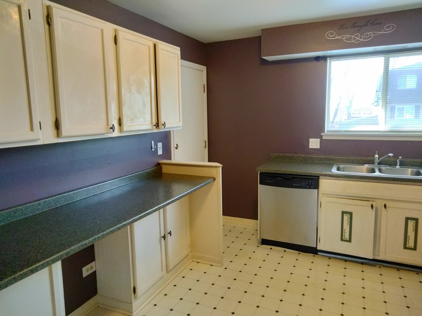896 South Plum Grove Road, Unit 217 Palatine, IL 60067 - Photo 4 of 15 a kitchen with granite countertop a sink and a stove
