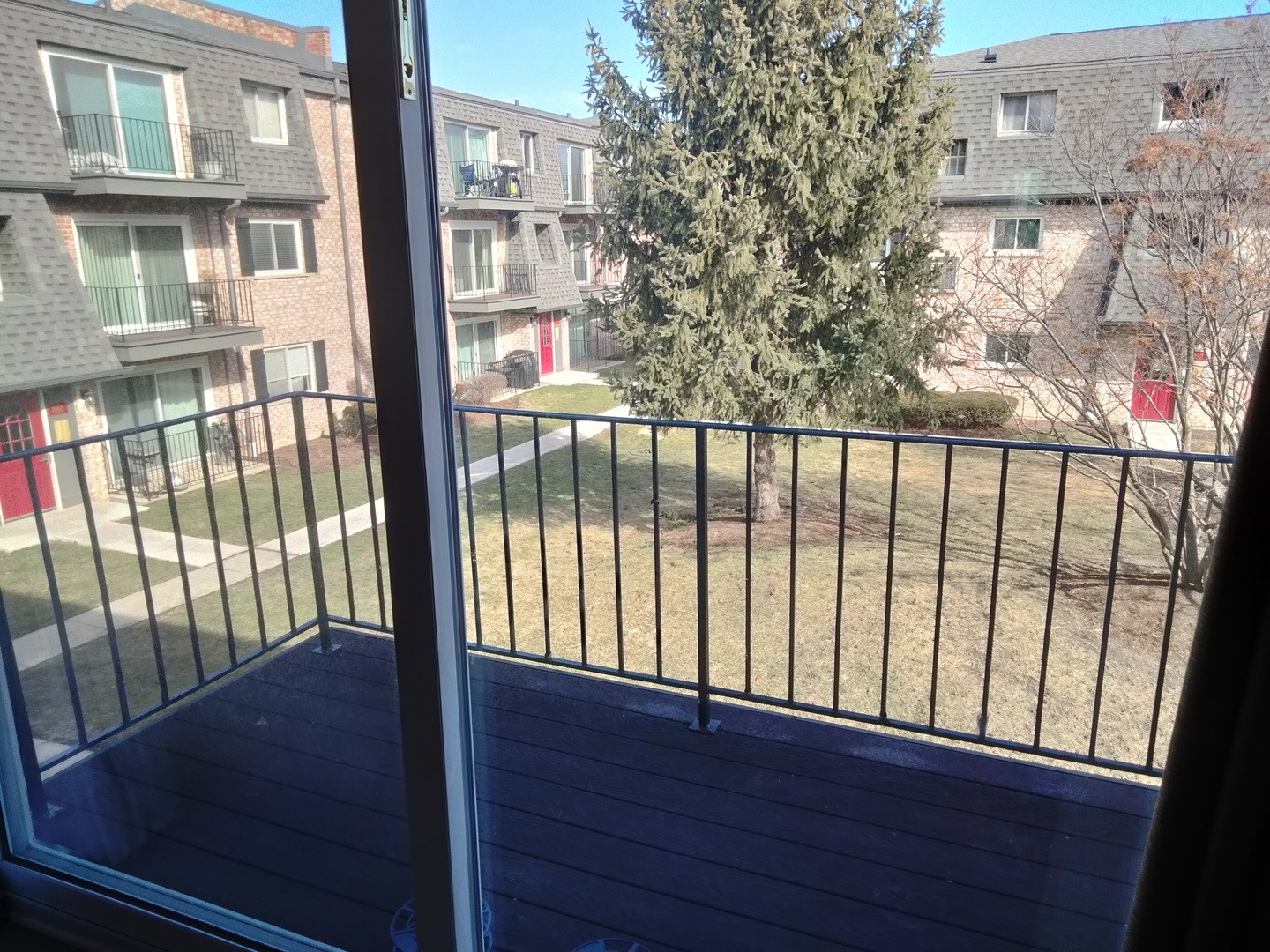 896 South Plum Grove Road, Unit 217 Palatine, IL 60067 - Photo 8 of 15 a view of a balcony with wooden floor