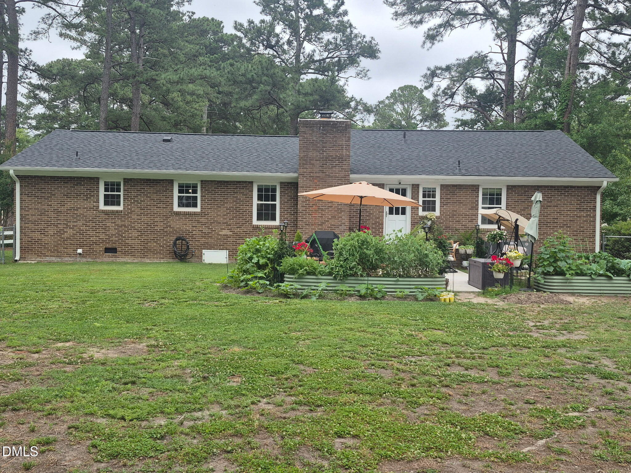 1219 Queen Anne Road Northwest Wilson, NC 27896 - Photo 22 of 26 a front view of house with yard and green space