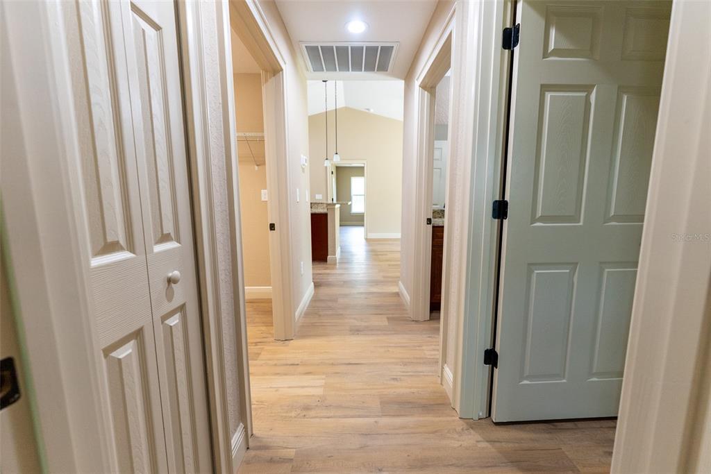 10 Cypress Loop Ocala, FL 34472 - Photo 47 of 65 a view of a hallway with wooden floor and staircase