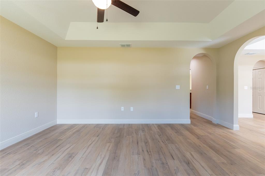 10 Cypress Loop Ocala, FL 34472 - Photo 9 of 65 a view of an empty room with wooden floor
