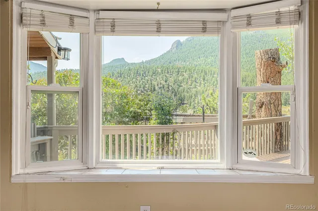 a view of a glass door and a window