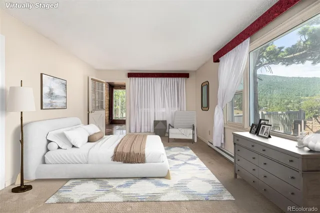 a living room with furniture large window and a wooden floor