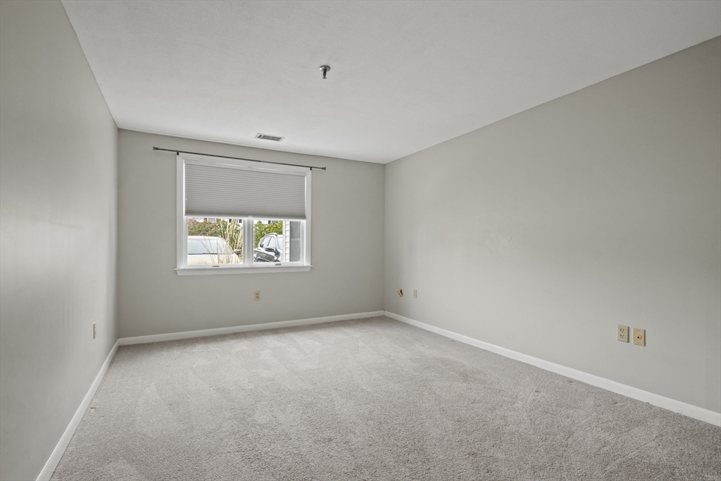 45 Christopher Drive, Unit 101 Methuen, MA 01844 - Photo 14 of 32 an empty room with windows