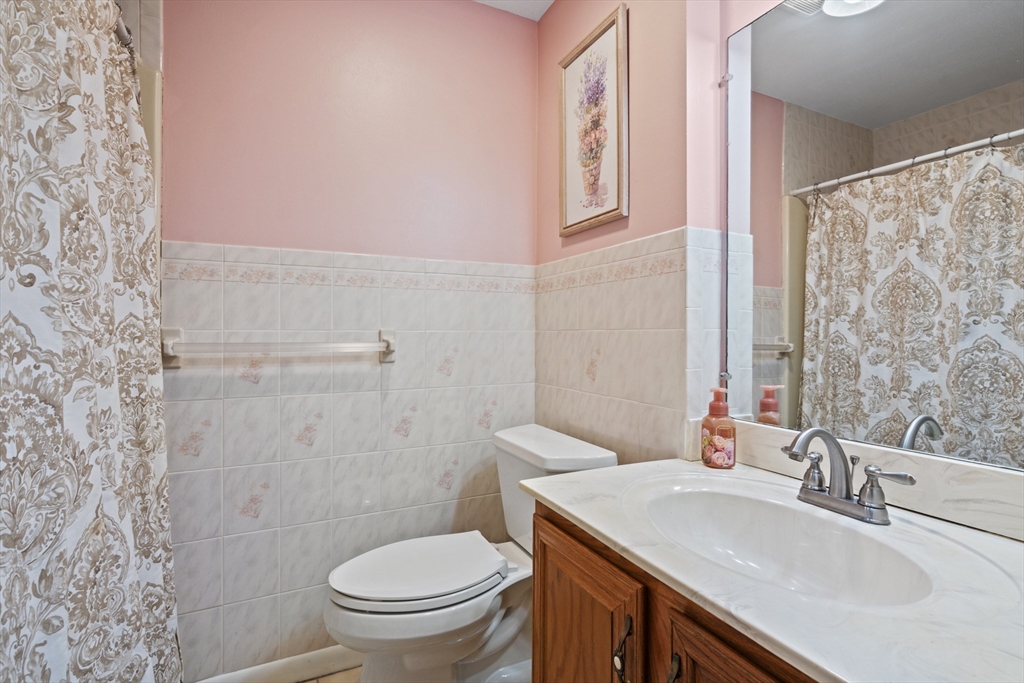 45 Christopher Drive, Unit 101 Methuen, MA 01844 - Photo 16 of 32 a bathroom with a sink toilet vanity and shower