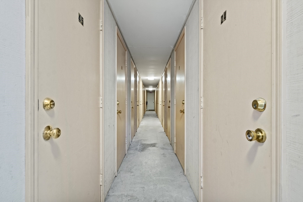 45 Christopher Drive, Unit 101 Methuen, MA 01844 - Photo 20 of 32 a view of a hallway with wooden floor