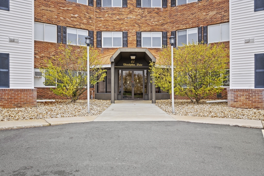 45 Christopher Drive, Unit 101 Methuen, MA 01844 - Photo 3 of 32 a house view with a outdoor space