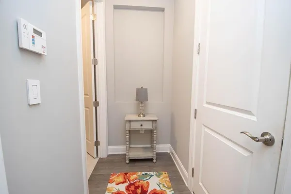 a room with a baby crib and a table